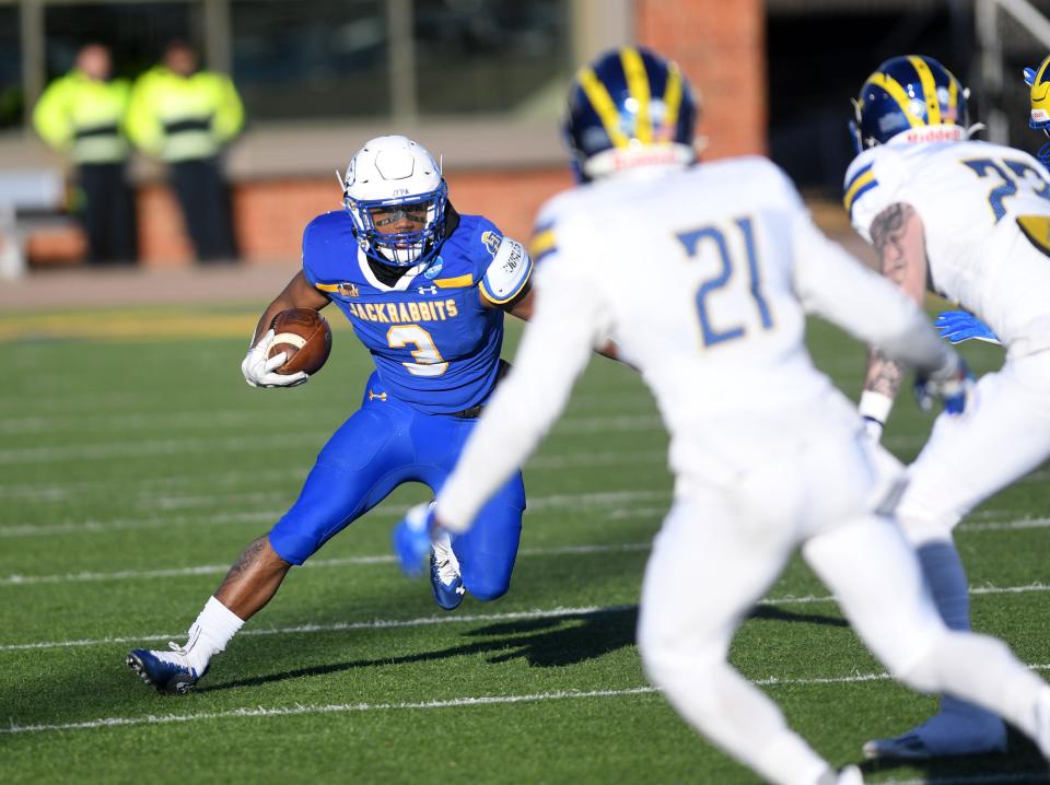 South Dakota State’s Amar Johnson carries the ball as Delaware tacklers move in at Dana J. Dykhouse Stadium in Brookings on Saturday.
