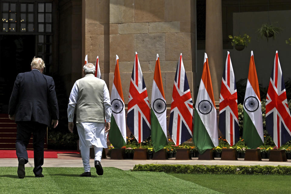 Britain's Prime Minister Boris Johnson, left, and his Indian counterpart Narendra Modi walk before their meeting at Hyderabad House in New Delhi Friday, April 22, 2022. (Ben Stansall/Pool Photo via AP)