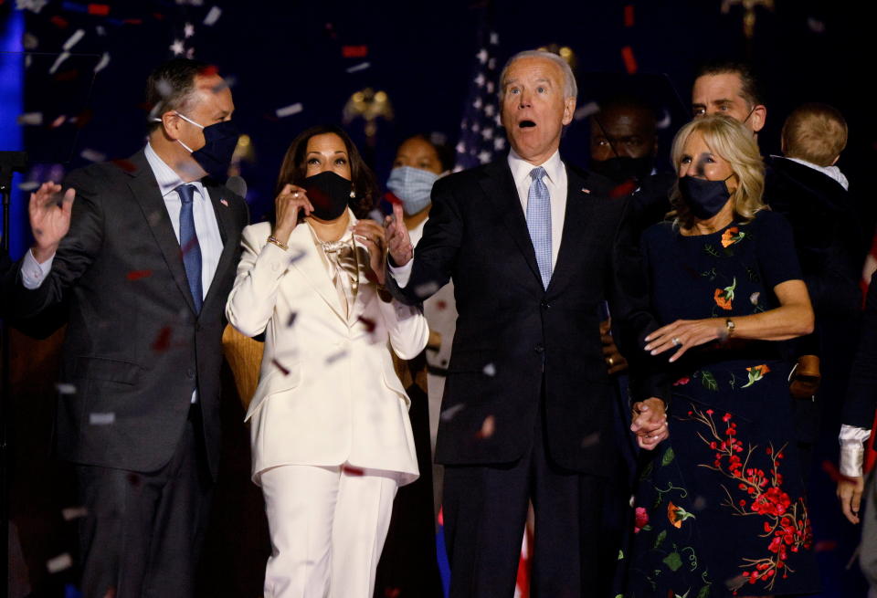 Democratic 2020 U.S. presidential nominee Joe Biden and his wife Jill, and Democratic 2020 U.S. vice presidential nominee Kamala Harris and her husband Doug, react to the confetti at their election rally, after the news media announced that Biden has won the 2020 U.S. presidential election over President Donald Trump, in Wilmington, Delaware, U.S., November 7, 2020. REUTERS/Jim Bourg     TPX IMAGES OF THE DAY