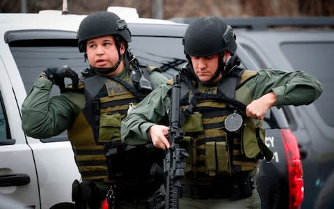 A shooting in a New York suburb not far from the Statue of Liberty left a police officer dead - Credit: KENA BETANCUR/AFP