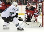 New Jersey Devils goaltender Mackenzie Blackwood (29) stops s shot by San Jose Sharks center Nick Bonino (13) during the second period of an NHL hockey game Tuesday, Nov. 30, 2021, in Newark, N.J. (AP Photo/Bill Kostroun)