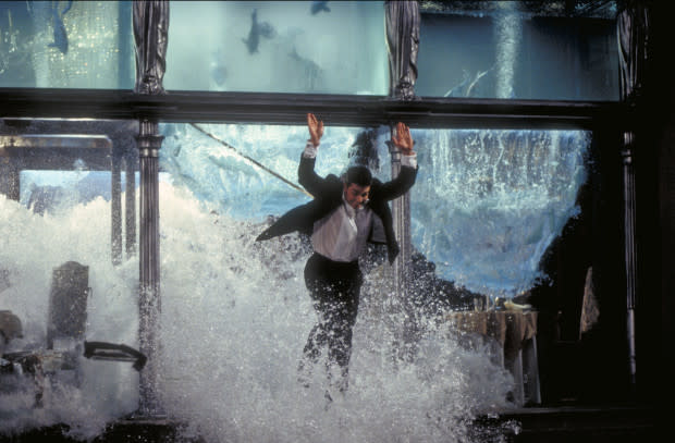 Tom Cruise as Ethan Hunt, escaping through the collapsing aquarium in a restaurant, in a scene from the film 'Mission: Impossible,' 1996.<p>Photo by Murray Close/Getty Images</p>