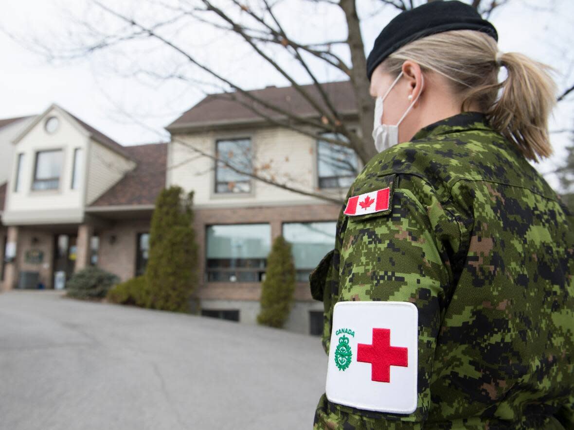 A member of the Canadian Armed Forces is shown at Residence Villa Val des Arbres, a long-term care home in Laval, Que., in an April 2020 photo. The Armed Forces confirmed to CBC News Saturday that it is prepared to help Saskatchewan with up to six critical care nursing officers, who will be working in intensive care units. (Graham Hughes/The Canadian Press - image credit)