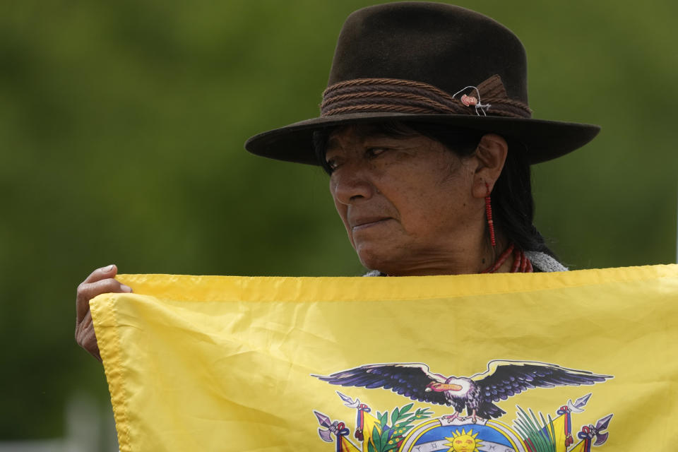 An Ecuador's fan watches the 20km race walk finals at the Pan American Games in Santiago, Chile, Sunday, Oct. 29, 2023. (AP Photo/Moises Castillo)