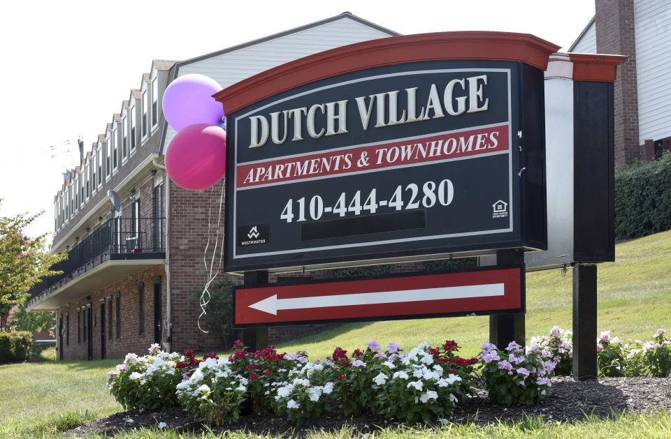 In this Monday, July 29, 2019, photo, a sign sits outside the Dutch Village apartments and townhomes, owned by the Kushner Cos., in Baltimore. Jared Kushner’s family real estate firm owns thousands of apartments and townhomes in the Baltimore area, and some have been criticized for the same kind of disrepair and neglect that the president has accused local leaders of failing to address. (AP Photo/Steve Ruark)