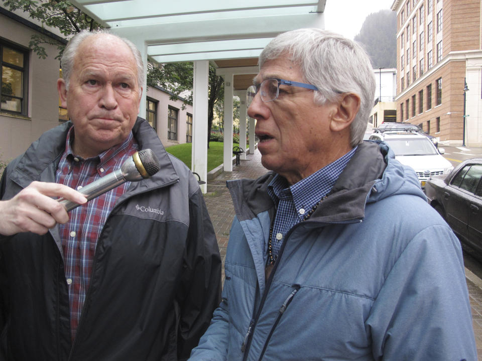 FILE - In this Aug. 21, 2017, file photo, Alaska Lt. Gov. Byron Mallott, right, speaks with reporters as Alaska Gov. Bill Walker listens in Juneau, Alaska. The governor of Alaska says Lt. Gov. Byron Mallott has resigned over unspecified "inappropriate comments." The move upends what was already a difficult re-election fight for Gov. Bill Walker. Mallott's decision was announced Tuesday, Oct. 16, 2018, shortly after Walker participated in a debate in Anchorage. (AP Photo/Becky Bohrer, File)