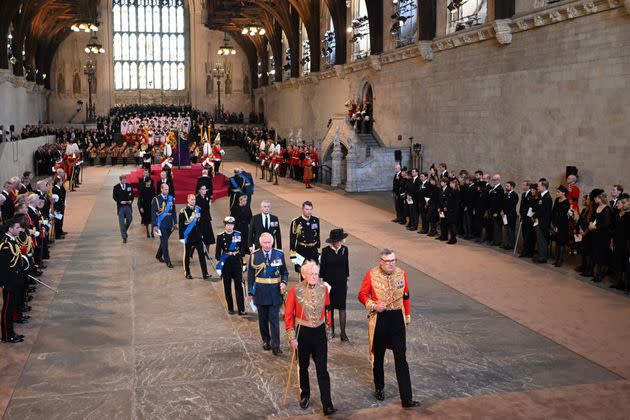 King Charles III leaves with Britain's Camilla, Queen Consort after a service for the reception of Queen Elizabeth II's coffin at Westminster Hall. (Photo: OLI SCARFF via Getty Images)