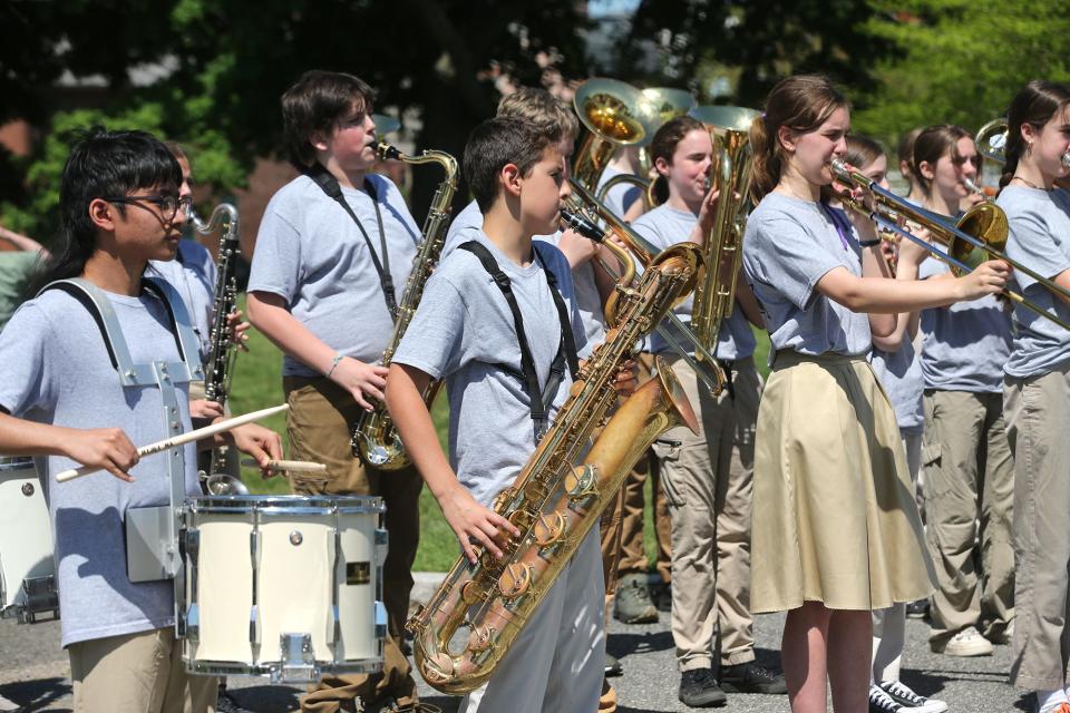 The Portsmouth Middle School band plays during the Burial at Sea ceremony in Portsmouth Friday, May 24, 2024.