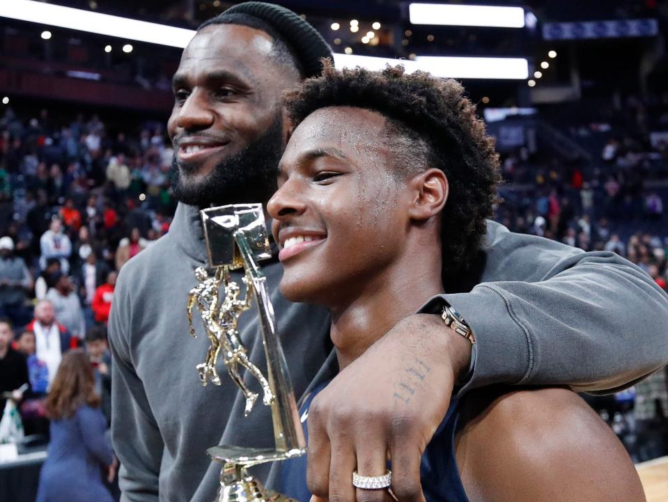 LeBron 'Bronny' James Jr. #0 of Sierra Canyon High School with his father LeBron James of the Los Angeles Lakers following the Ohio Scholastic Play-By-Play Classic against St. Vincent-St. Mary High School at Nationwide Arena on December 14, 2019