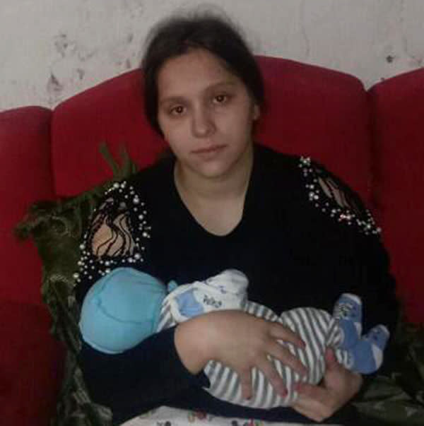Rosalina Hryhorychenko holding a baby.
