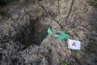 A clandestine grave is seen at Pueblo Viejo, in the outskirts of Iguala, southern Mexican state of Guerrero October 7, 2014. REUTERS/Henry Romero