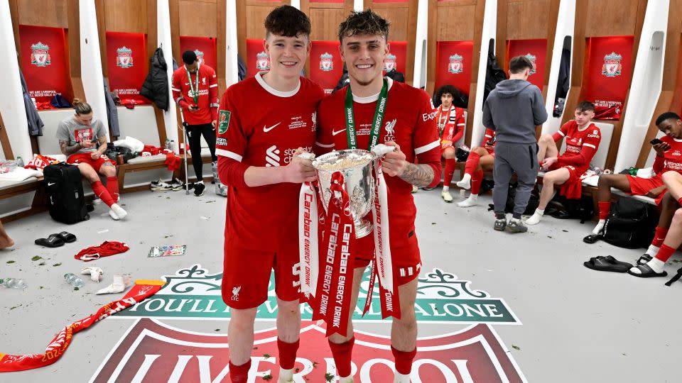James McConnell (left) and Bobby Clark (right) celebrate with the Carabao Cup after Liverpool beat Chelsea in the final of the competition. - Andrew Powell/Liverpool FC/Getty Images