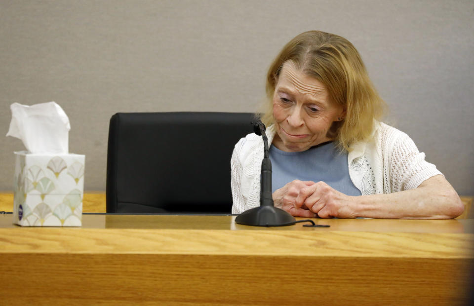 Karen Guyger takes a moment to herself on the witness stand during the sentencing phase of her daughter Amber Guyger's trial, at the Frank Crowley Courts Building in Dallas, Wednesday, Oct. 2, 2019. Guyger, a former Dallas police officer, was convicted of murder Tuesday in the killing of Botham Jean and faces a sentence that could range from five years to life in prison or be lowered to as little as two years if the jury decides the shooting was a crime of sudden passion. (Tom Fox/The Dallas Morning News via AP, Pool)