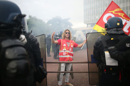 A French CGT labour union worker reacts during clashes at a demonstration against the government's labour reforms in Nantes, France, September 21, 2017. REUTERS/Stephane Mahe