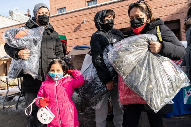 New York Cares volunteers in partnership with a local nonprofit and state Assembly Member Catalina Cruz distribute holidays toys and winter coats in Corona, Queens, in December.  (Photo: Pacific Press via Getty Images)