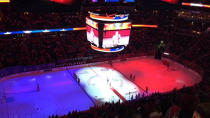 The ice is lit up in French national colours before the Calgary Flames v Washington Capitals NHL match at Verizon Centre.