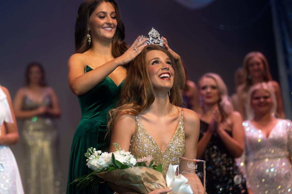 Mississippi Miss Hospitality 2022 Hannah Grace Crain of Hernando is crowned by Miss Hospitality 2021 Jane Granberry at the end of the annual competition held Saturday at the Hattiesburg Saenger Theater.