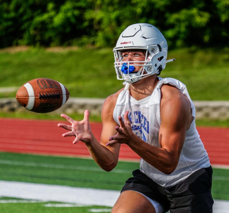 Oak Creek's Drew Braam reaches for a pass during high school football practice on Wednesday, August 2, 2023.