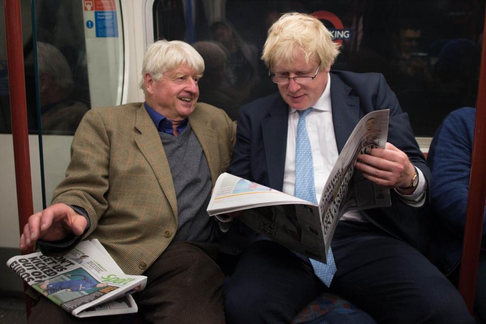 Boris Johnson sits next to his father Stanley on the Bakerloo Line in London (Stefan Rousseau/PA) (PA Archive)