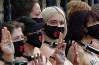 Climate activists are seen padlocked to the railings of the Houses of Parliament during an Extinction Rebellion protest in London, Britain, September 10, 2020. REUTERS/Toby Melville