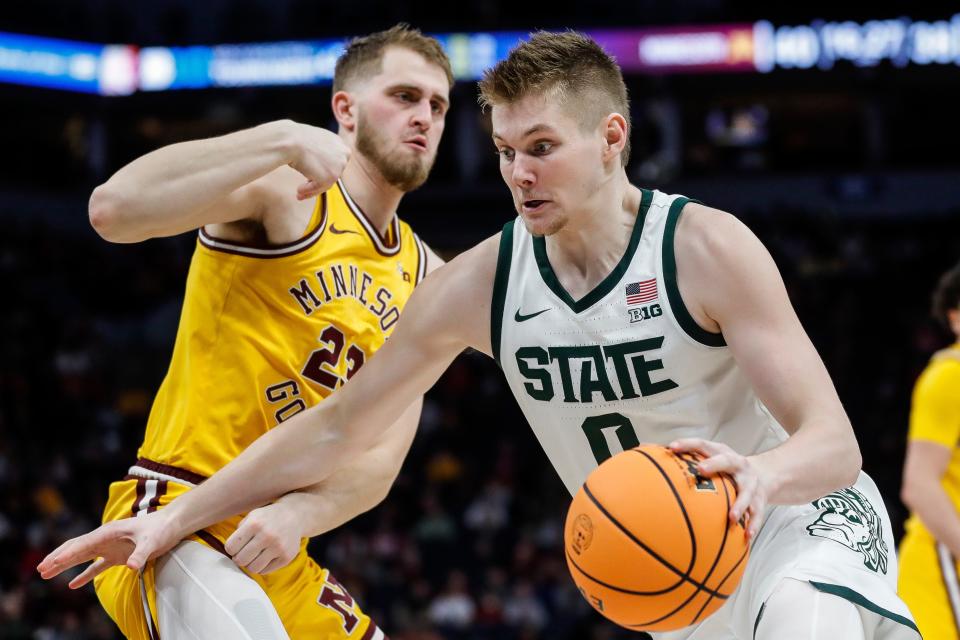 Michigan State forward Jaxon Kohler (0) dribbles against Minnesota forward Parker Fox (23) during the second half of Second Round of Big Ten tournament at Target Center in Minneapolis, Minn. on Thursday, March 14, 2024.