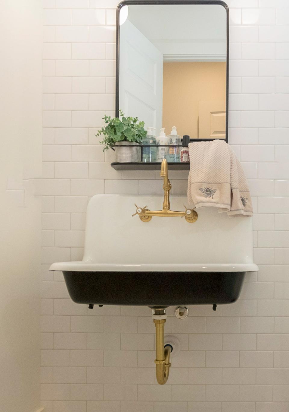 This trough sink provides a throw-back version of a spare bathroom.