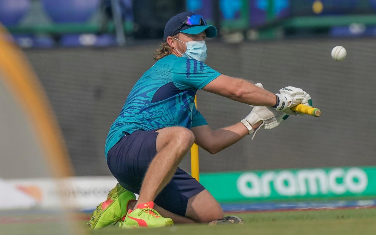 A Bangladesh team support staff wearing mask to protect against air pollution takes part in a practice session ahead of the ICC Men's Cricket World Cup match between Bangladesh and Sri Lanka in New Delhi, India