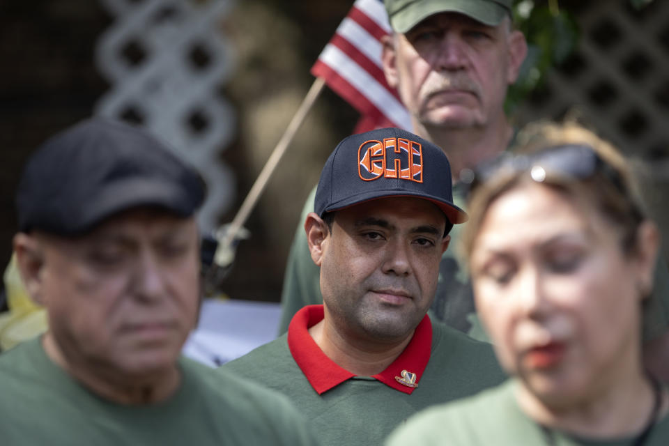 United States Army veteran Miguel Perez Jr. stands with his mother Esperanza Perez at a news conference Tuesday, Sept. 24, 2019, at Lincoln Methodist Church in Chicago. Perez, an Army veteran who was deported to Mexico in 2018, arrived back in Chicago Tuesday for a final chance at becoming a U.S. citizen and living in the city he has called home since boyhood. (Erin Hooley/Chicago Tribune via AP)