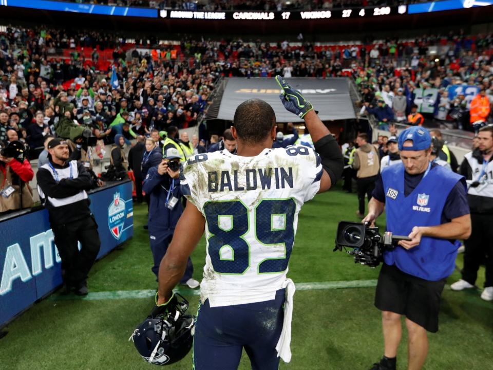 Doug Baldwin salutes the Wembley crowd as he leaves the field: Action Images via Reuters