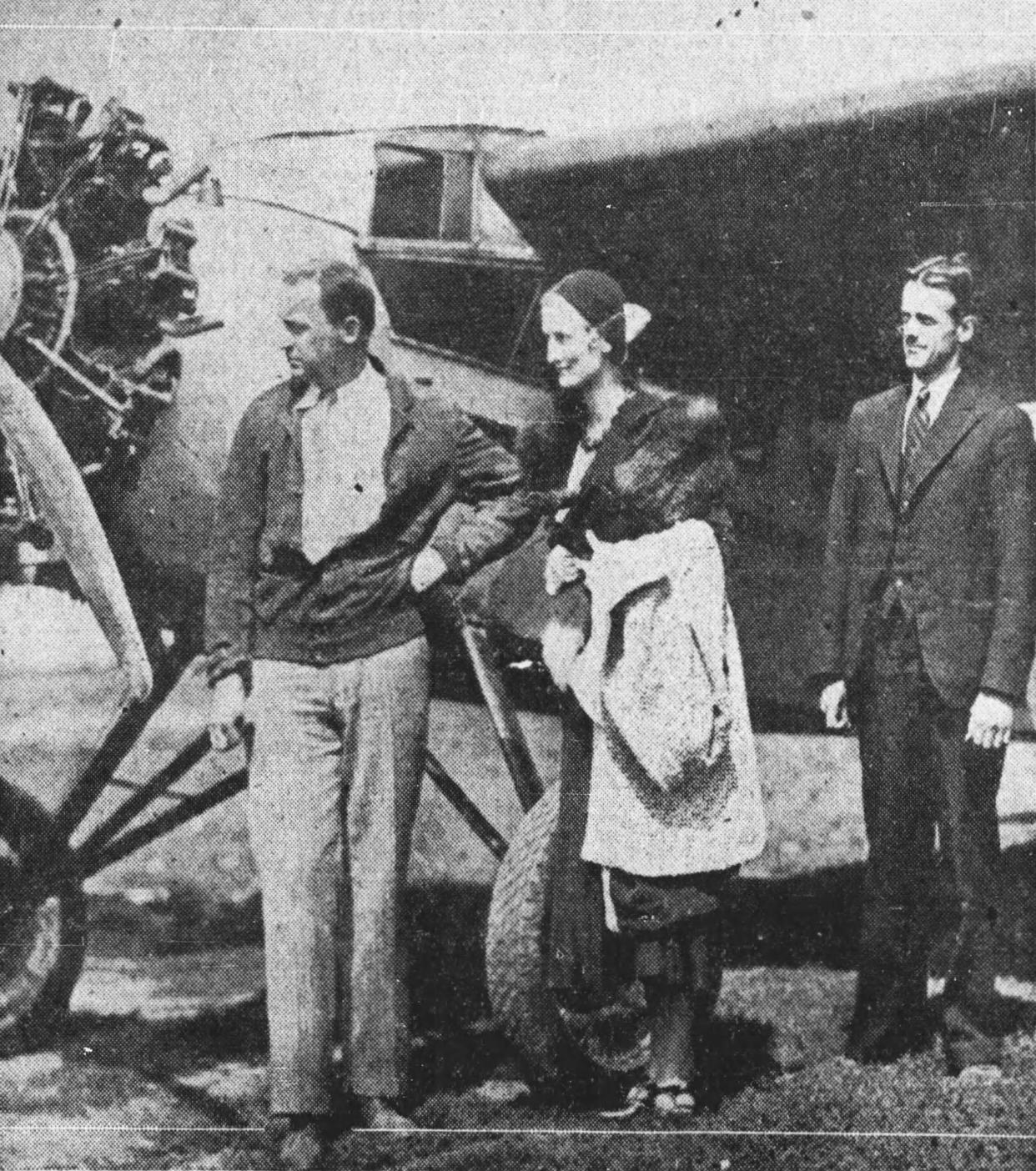 From left, Edwin A. Link Jr., Marion Link and reporter George Spargo prepare to take to the skies to see the eclipse in 1932.