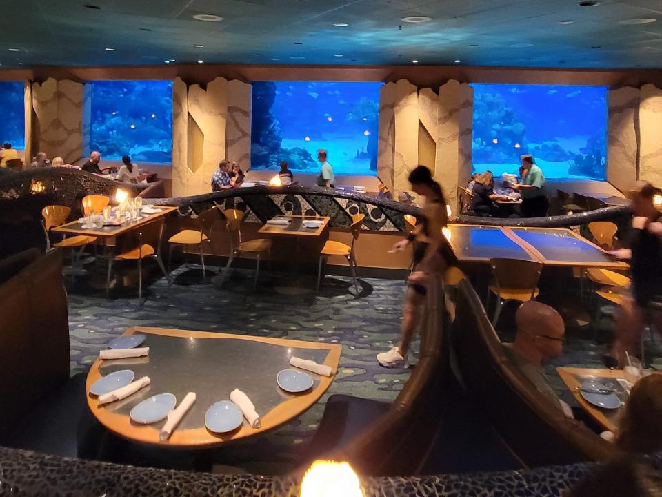 an interior shot of the dining room at coral reef restaurant in epcot disney world