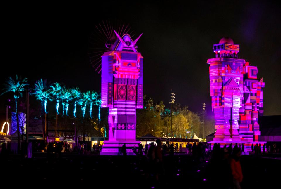 "The Messengers" by Kumkum Fernando are seen at night during the Coachella Valley Music and Arts Festival at the Empire Polo Club in Indio, Calif., Friday, April 14, 2023.