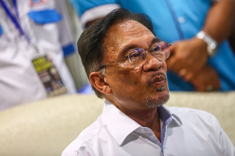 Anwar said the government should call for a review of the decision. — Picture by Hari Anggara