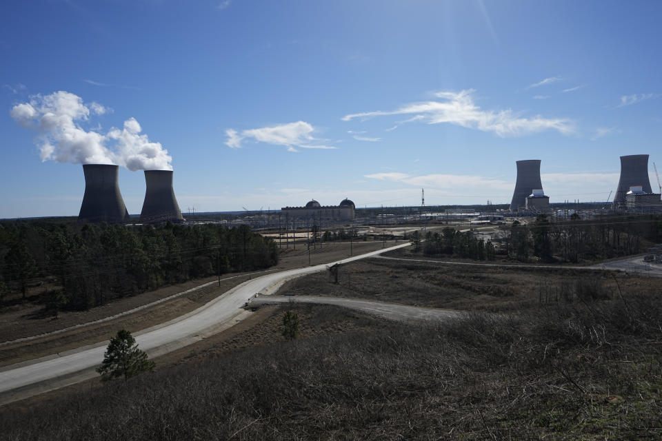 FILE - Georgia Power Co.'s Plant Vogtle nuclear power plant stands on Jan. 20, 2023, in Waynesboro, Ga. Two older reactors are seen, left, and two new reactors, right. Company officials announced Wednesday, May 24, 2023, that Unit 3 would reach full power in coming days, after years of delays and billions in cost overruns. (AP Photo/John Bazemore, File)