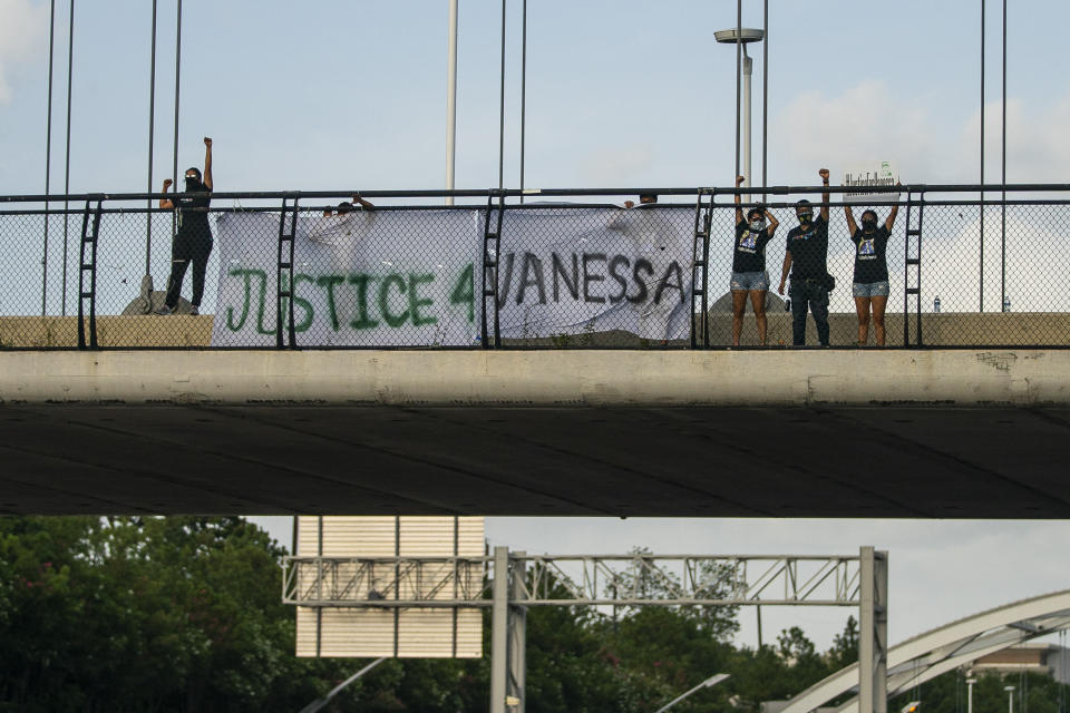 Members of #TeamVanessa and FIEL Houston gather demanding justice for Army Spc. Vanessa Guillen on the Dunlavy Street bridge that goes over the Southwest Freeway in Houston on Wednesday, July 8, 2020. (Mark Mulligan/Houston Chronicle via AP)