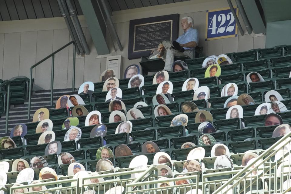 Milwaukee Brewers' fans are seen on picture cut outs in the upper deck during a practice session Monday, July 13, 2020, at Miller Park in Milwaukee. (AP Photo/Morry Gash)