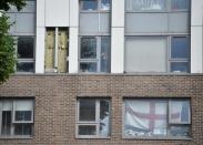 Cladding is seen on the Burnham Tower residential block, from where residents were evacuated as a precautionary measure following concerns over the type of cladding used on the outside of the building on the Chalcots Estate in north London, Britain, June 24, 2017. REUTERS/Hannah McKay