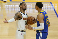 Denver Nuggets guard Monte Morris (11) gestures toward Golden State Warriors forward Juan Toscano-Anderson during the second half of an NBA basketball game in San Francisco, Monday, April 12, 2021. (AP Photo/Jeff Chiu)