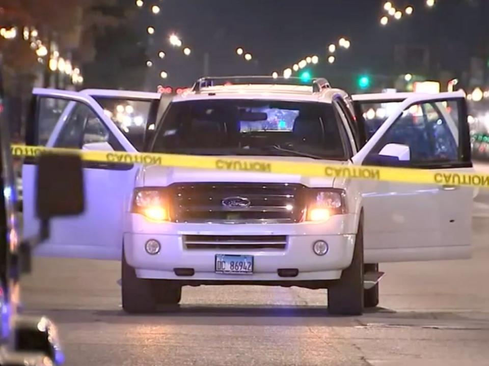 Police at the scene of the shooting on Friday night (WLS via CNN)