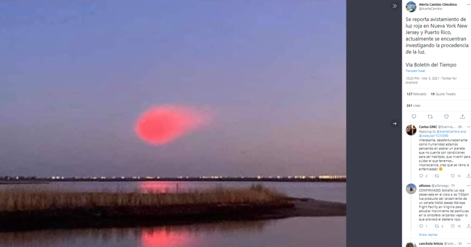 Social media erupted Wednesday with reports of a mysterious red cloud floating off the East Coast. NASA says the cloud was associated with a rocket launch. Twitter screenshot