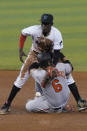 Miami Marlins second baseman Jazz Chisholm Jr., rear, drops the ball as Baltimore Orioles' Ryan Mountcastle (6) steals the base during the third inning of a baseball game, Wednesday, April 21, 2021, in Miami. (AP Photo/Marta Lavandier)