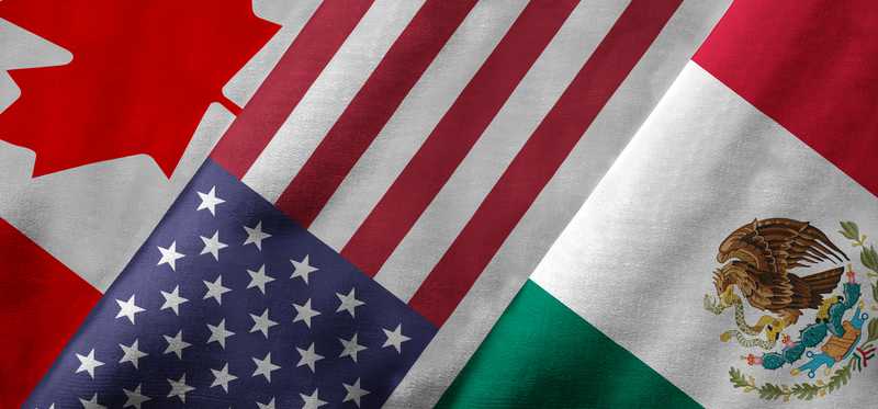 Canadian American and Mexican flags next to each other