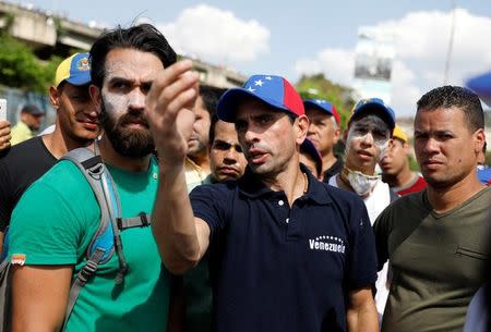 Opposition leader Henrique Capriles (C) gestures during a rally in Caracas, Venezuela, April 8, 2017. REUTERS/Carlos Garcia Rawlins