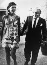 <p>Jackie and her second husband, Aristotle Onassis, leave an Athens nightclub after celebrating her 40th birthday. Jackie wears a minidress with a bold pattern, a long string of pearls, and Lalaounis earrings.<br></p>