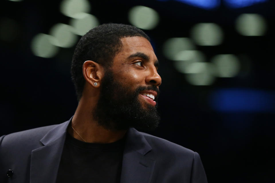 Nets point guard Kyrie Irving returned to practice for the first time since mid-November. (Mike Stobe/Getty Images)