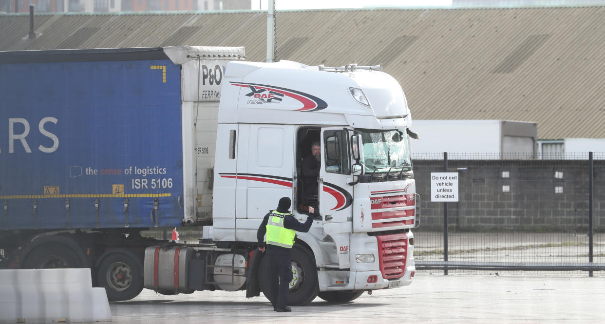 A Border Force officer talks to a lorry driver at the Department of Agricultural, Environment and Rural Affairs facility on Duncrue Street near Belfast Harbour, as post-Brexit checks at all Northern Ireland's ports resume. Inspections of animal-based food produce arriving at Belfast and Larne ports were suspended amid concerns over the safety of staff. Picture date: Wednesday February 10, 2021. (Photo by Niall Carson/PA Images via Getty Images)