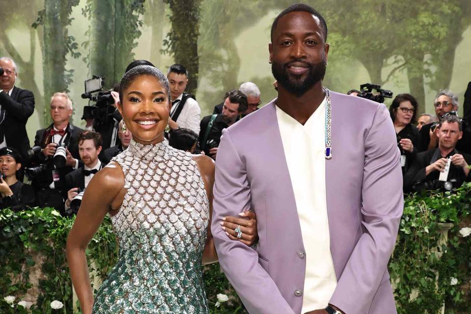 <p>Jamie McCarthy/Getty</p> Gabrielle Union and Dwyane Wade at the 2024 Met Gala celebrating Sleeping Beauties: Reawakening Fashion at the Metropolitan Museum of Art in New York City on May 6, 2024.