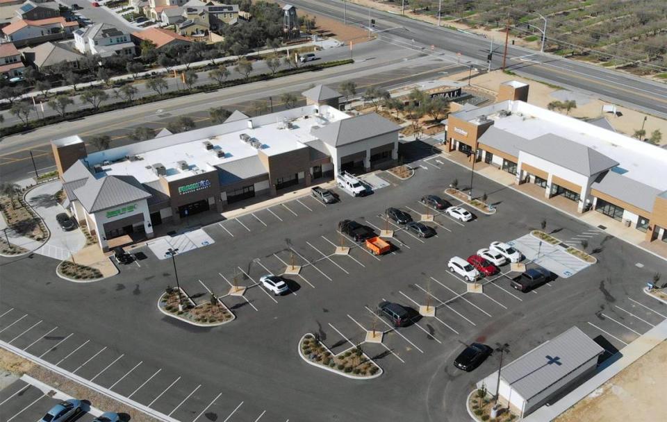 The new Riverwalk shopping center, located next to Riverstone housing development, top left, situated just west of Highway 41 and south of Avenue 12, seen at the top right corner near Madera. Photographed Wednesday, Jan. 26, 2022.