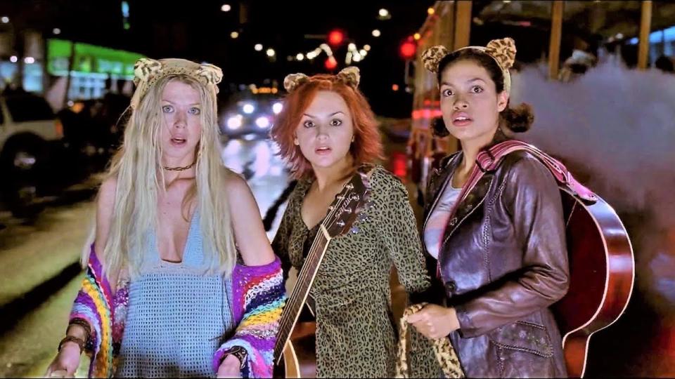 Tara Reid, Rachael Leigh Cook and Rosario Dawson as Josie and the Pussycats looking surprised