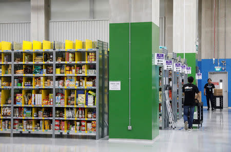 Employees work at Amazon's Prime Now fulfillment centre in Singapore July 27, 2017. REUTERS/Edgar Su